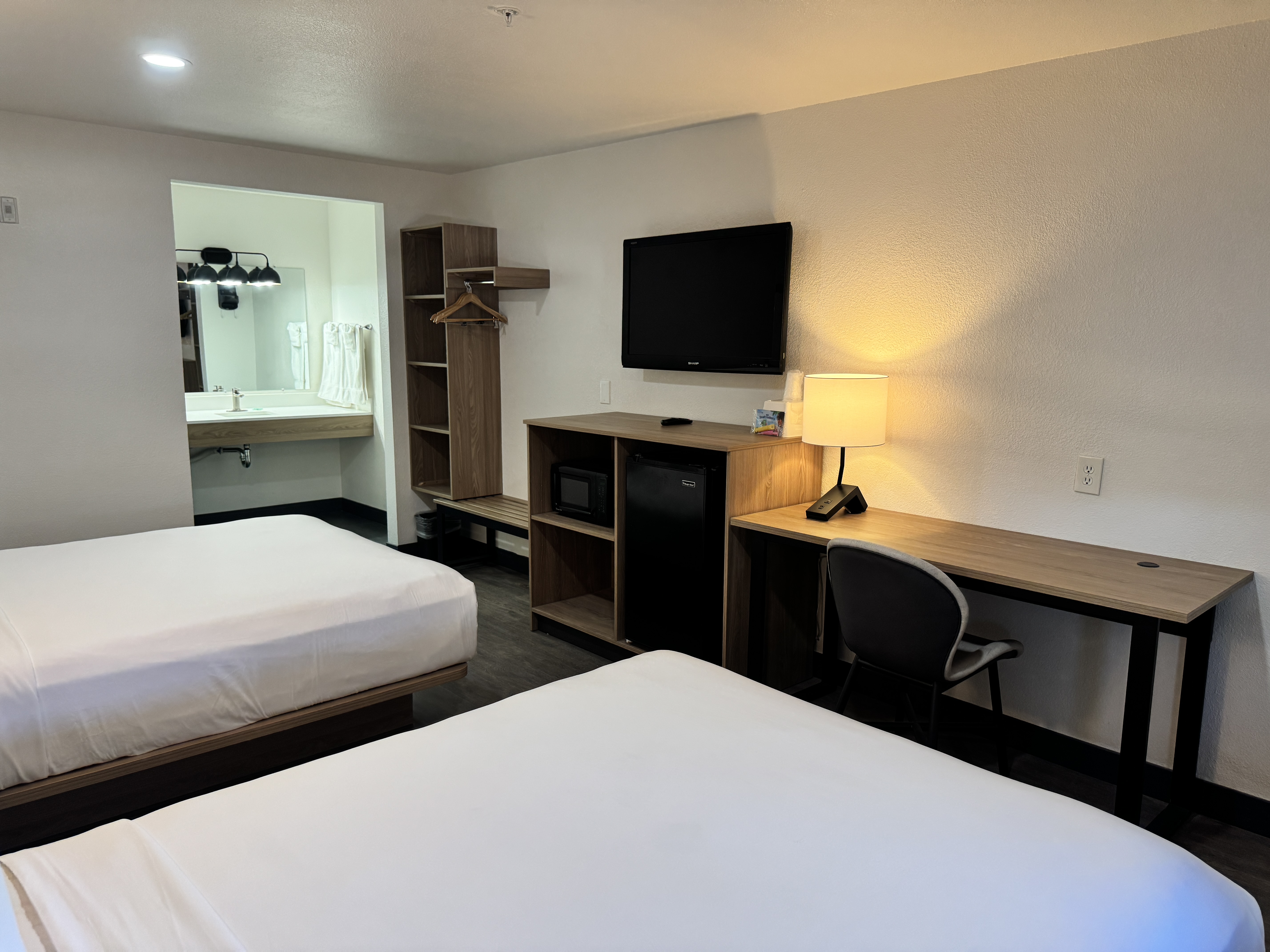 Two queen room with modern beds and window seating